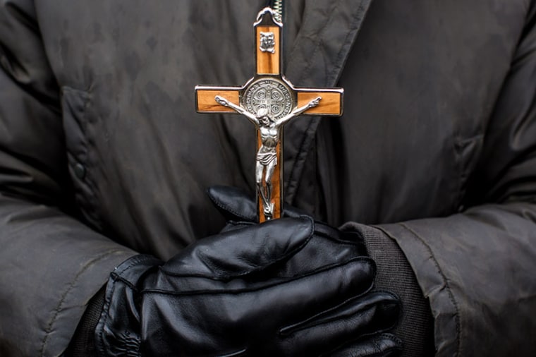 An anti-abortion protester holds a crucifix at the March for Life on January 25, 2013 in Washington, DC. The pro-life gathering is held each year around the anniversary of the Roe v. Wade Supreme Court decision. (Photo by Brendan Hoffman/Getty Images)