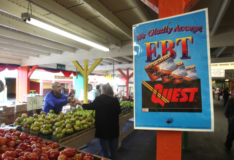 A sign announcing the acceptence of electronic Benefit Transfer cards is seen at the Denios Farmers market in Roseville, Calif., Saturday,  Feb. 6, 2010.   (AP Photo/Rich Pedroncelli)