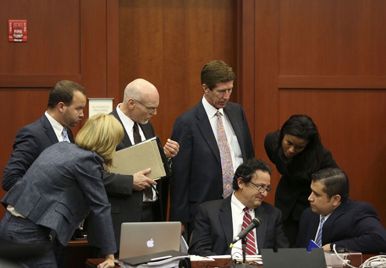 George Zimmerman, right, confers with his defense team during jury selection for his trial in Seminole circuit court in Sanford, Fla., Thursday, June 20, 2013. (Photo by Gary Green/Orlando Sentinel/Pool/AP)