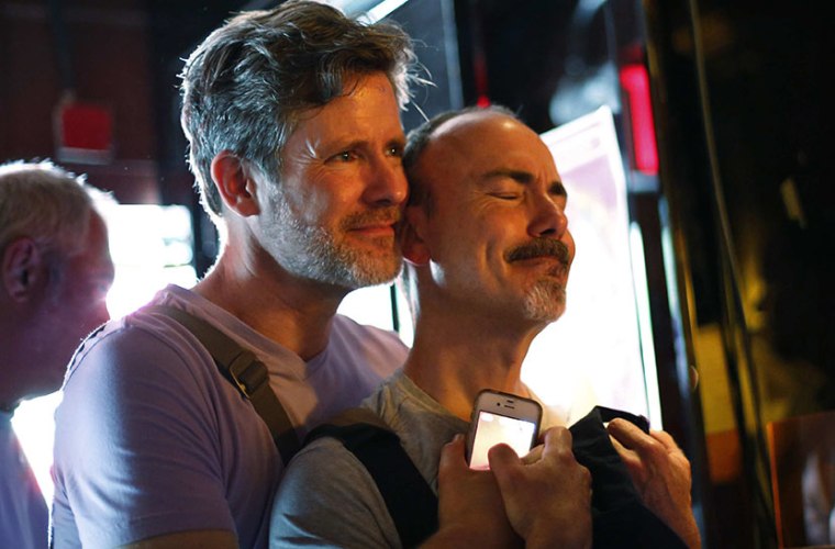 Watching coverage of the U.S. Supreme Court ruling on the Defense of Marriage Act at the Stonewall Inn in New York June 26, 2013.    (Photo by Brendan McDermid/Reuters)