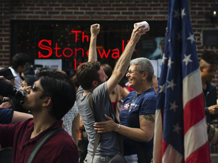 People embrace and cheer as they join a crowd celebrating the U.S. Supreme Court ruling against the Defense of Marriage Act outside the Stonewall Inn in New York June 26, 2013. (Photo by Lucas Jackson/Reuters)
