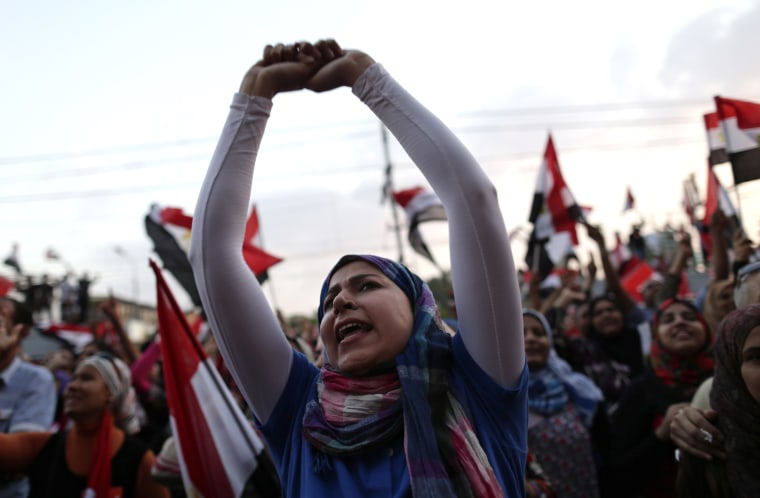 Egyptian women chant slogans during a protest outside the presidential palace, in Cairo, Egypt, Tuesday, July 2, 2013. Egypt was on edge Tuesday following a \"last-chance\" ultimatum the military issued to Mohammed Morsi, giving the president and the...