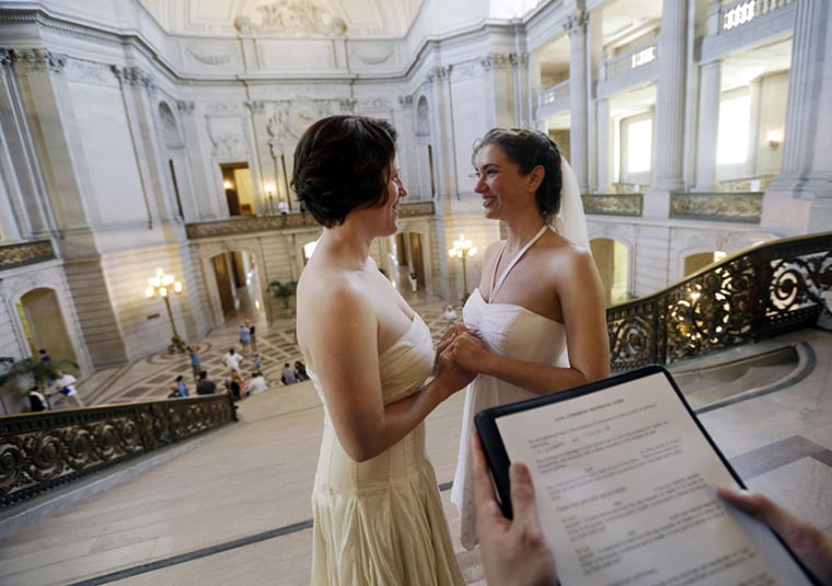 Cynthia Wides, right, and Elizabeth Carey exchange wedding vows at City Hall in San Francisco, Saturday, June 29, 2013. (Photo by Marcio Jose Sanchez/AP)