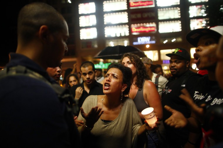 People react after hearing the news that George Zimmerman was found not guilty in the 2012 shooting death of Trayvon Martin, in New York July 13, 2013.  (Photo by Eric Thayer/Reuters)