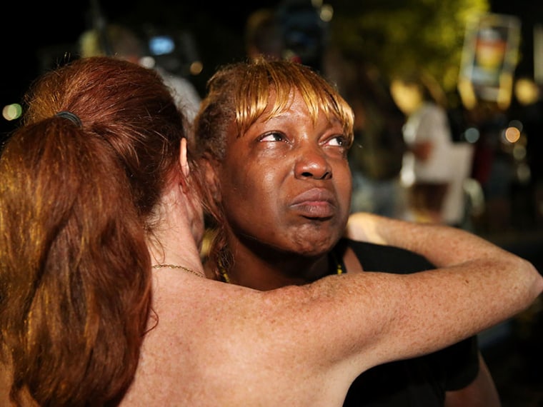 Tanetta Foster is comforted by Erika Rodgers (L) after she breaks into tears in front of the Seminole County Criminal Justice Center after learning George Zimmerman had been found not guilty in the Murder of Trayvon Martin on July 13, 2013 in Sanford,...