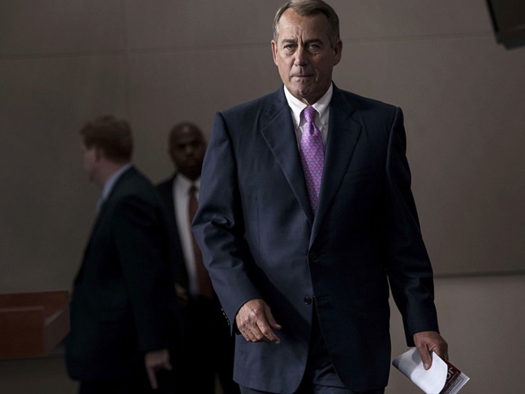 Speaker of the House John Boehner (R-OH) arrives for a weekly press briefing on Capitol Hill on June 27, 2013 in Washington, DC. (Photo by Brendan Smialowski/AFP/Getty Images}