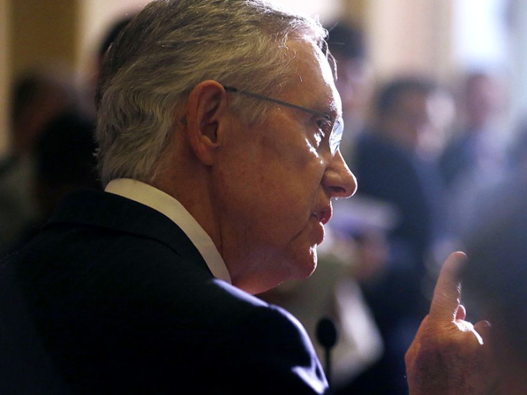 Senate Majority Leader Harry Reid of Nevada speaks to reporters as lawmakers moved toward resolving their feud over filibusters of White House appointees on Capitol Hill in Washington, Tuesday, July 16, 2013. (Photo by Charles Dharapak/AP)