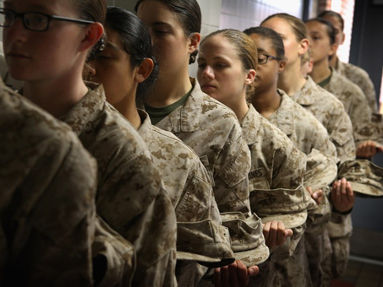 Female Marine recruits stand in line before getting lunch in the chow hall during boot camp on February 26, 2013 at MCRD Parris Island, South Carolina.   (Photo by Scott Olson/Getty Images)