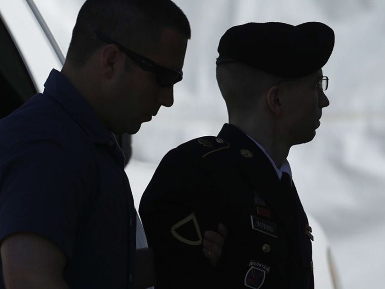 U.S. Army Private First Class Bradley Manning (R) enters the courthouse at Fort Meade, Maryland, July 30, 2013. (Photo by Gary Cameron/Reuters)