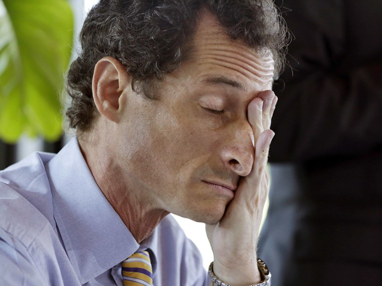 New York mayoral candidate Anthony Weiner rubs his eyes during a candidate forum on small business, in the Inwood section of the borough of Manhattan, in New York,  Tuesday, July 30, 2013. (Photo by Richard Drew/AP)