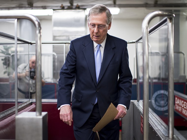 Senate Minority Leader Mitch McConnell gets on the Senate subway in the Capitol following a vote on Tuesday, July 30, 2013. (Photo by Bill Clark/CQ Roll Call/Getty)