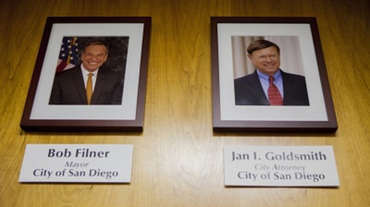 Photos of San Diego Mayor Bob Filner and San Diego City Attorney Jan Goldsmith hang inside the City Council chambers at San Diego City Hall. (Photo by Sam Hodgson/Reuters)