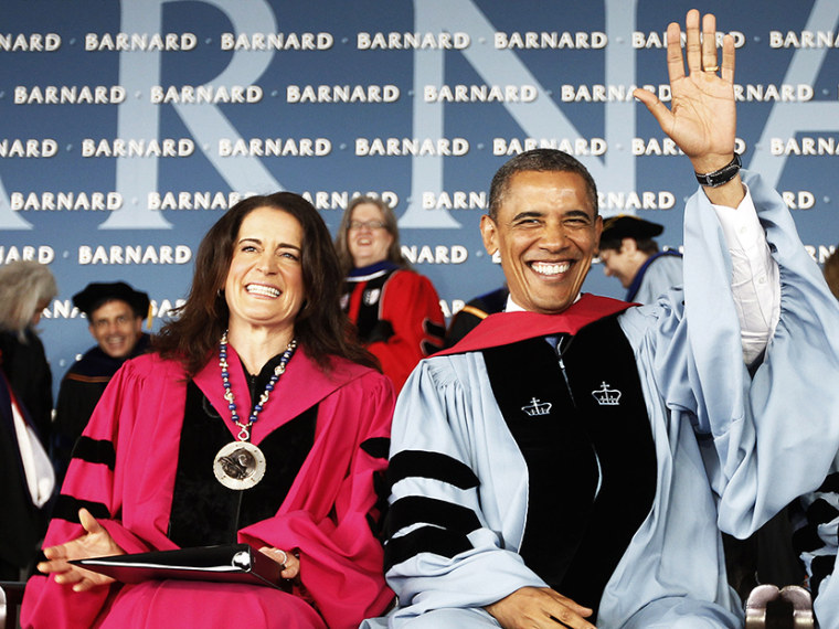 President Barack Obama, accompanied by Barnard College President Debora L. Spar, acknowledges applause as they take their seat before the president gave a commence address at Barnard College, Monday, May 14, 2012, in New York. (Photo by Pablo Martinez...