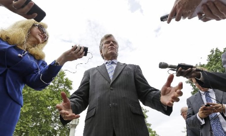 File photo: McDonnell gestures as he answers reporters questions in  Richmond, Va., Monday, June 24, 2013. (Photo by: Steve Helber/AP Photo)