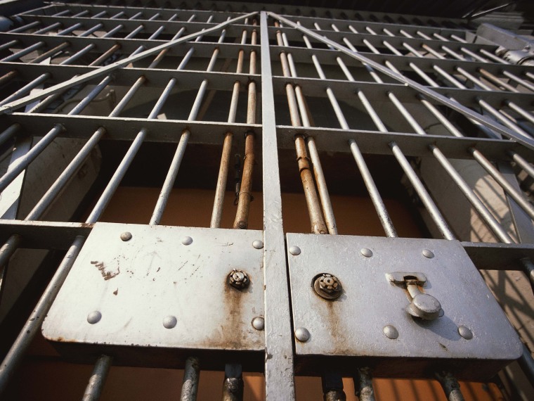 Prison Bars. (Stock photo by GeoStock/Photodisc/Getty Images)