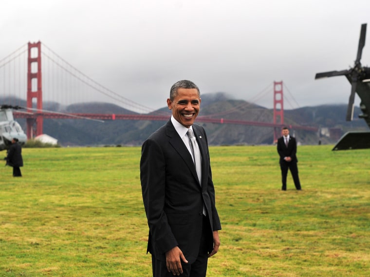 US President Barack Obama smiles before boarding Marine One helicopter from a field overlooking the iconic golden gate bridge in San Francisco, California, on April 4, 2013. Obama is in California to attend two DCCC fund rising events. (Photo by Jewel...