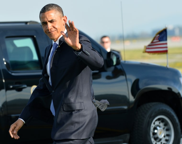 US President Barack Obama waves as he arrives at San Francisco International Airport in San Francisco, California, on April 3, 2013. (Photo by Jewel Samad/AFP/Getty Images)