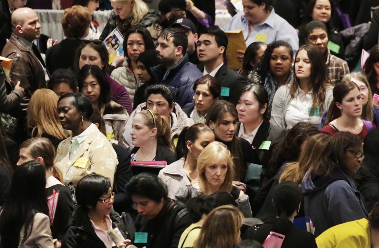 A crowd of job seekers attends a health care job fair, Thursday, March 14, 2013 in New York. (AP Photo/Mark Lennihan)