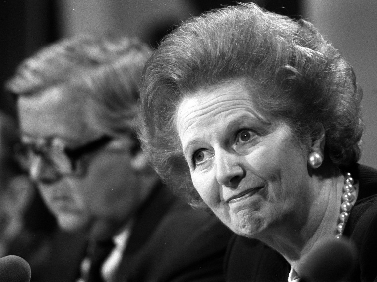 File photo dated 22/5/89 of Margaret Thatcher fielding questions with Foreign Secretary, Geoffrey Howe (background), at a press conference, in London. (Photo by Martin Keene/Press Association via AP Images, File)