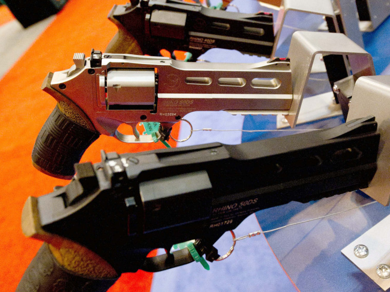 File Photo: Rhino 500 handguns are on display at the National Rifle Association (NRA) Annual Meetings and Exhibits on April 14, 2012 in St. Louis, Missouri.  (Photo by Karen Bleier/AFP/Getty Images, File)