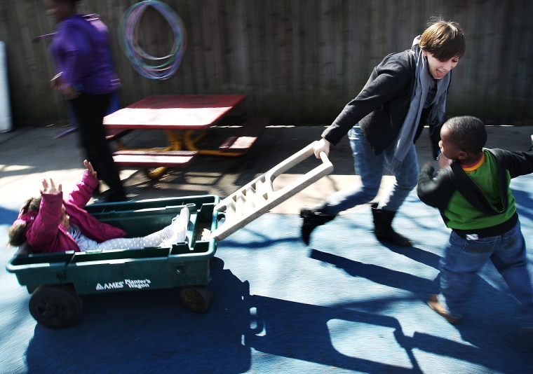 Kyra Smith, 19, a sophomore at Muhlenberg College, runs through the playground at Hope House in Memphis, Tenn. Thursday March 7, 2013, playing with children that attend there. A group of 15 students and four faculty members from the college in...