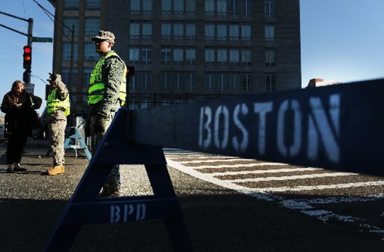 BOSTON, MA - APRIL 16: National Guard soldiers guard a roadblock near the scene of a twin bombing at the Boston Marathon on April 16, 2013 in Boston, Massachusetts. The twin bombings, which occurred near the marathon finish line, resulted in the deaths...