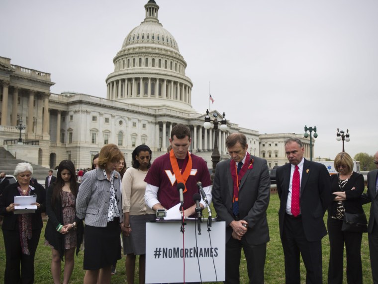 On the sixth anniversary of the Virginia Tech shooting, Colin Goddard, who was shot four times, leads a moment of silence for the 32 victims, along with the '3,300 lives lost to gun violence since the Newtown shooting,' outside the U.S. Capitol in...