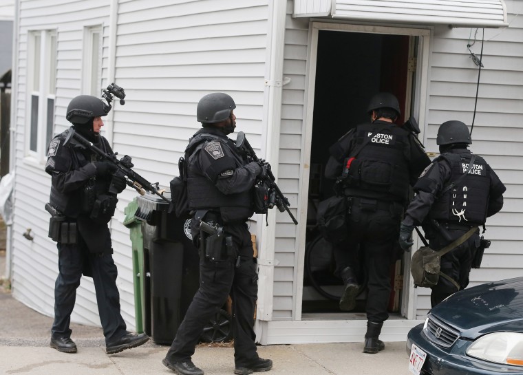 SWAT team members search for the second suspect at a residential building on April 19, 2013 in Watertown, Massachusetts. (Photo by Mario Tama/Getty Images)