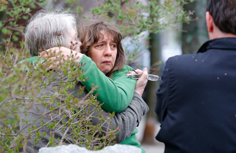 A woman reacts while being questioned by the Cambridge Police and other law enforcement agencies on April 19, 2013, near the home of the Boston bombing suspects in Cambridge, Massachusetts. (Photo by Jared Wickerham/Getty Images)