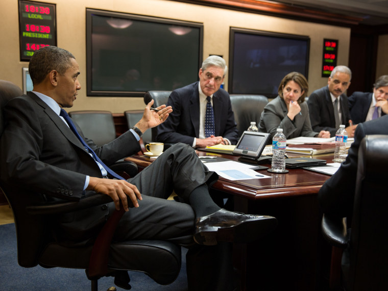 In this handout provided by the White House, U.S. President Barack Obama (L) meets with members of his national security team to discuss developments in the Boston bombings investigation, in the Situation Room of the White House on April 19, 2013 in...