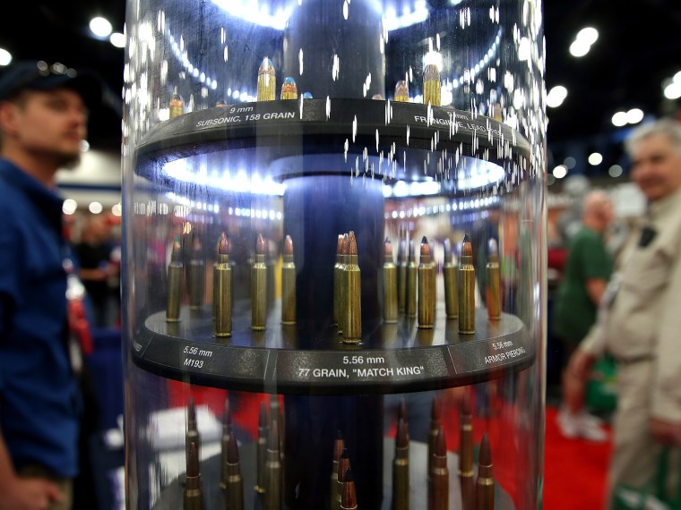 Attendees look at a display of ammunition during the 2013 NRA Annual Meeting and Exhibits at the George R. Brown Convention Center on May 3, 2013 in Houston, Texas.  More than 70,000 people are expected to attend the NRA's 3-day annual meeting that...