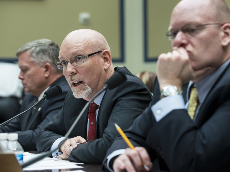 Gregory Hicks (C), Foreign Service Officer and former Deputy Chief of Mission/Charge Affairs in Libya, speaks while Mark Thompson (L), acting Deputy Assistant Secretary for Counter terrorism at the US State Department, and Eric Nordstrom, Diplomatic...