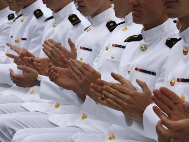 Midshipmen clap as U.S. President Barack Obama speaks at the U.S. Naval Academy commencement ceremony in Annapolis, May 24, 2013. Photo by Larry Downing/Reuters