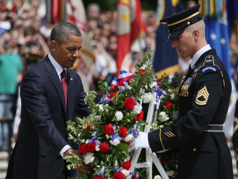 President Barack Obama positions a commemorative wreath during a ceremony on Memorial Day at the Tomb of the Unknowns at Arlington National Cemetery on May 27, 2013 in Arlington, Va. (Photo by Mark Wilson/Getty Images)