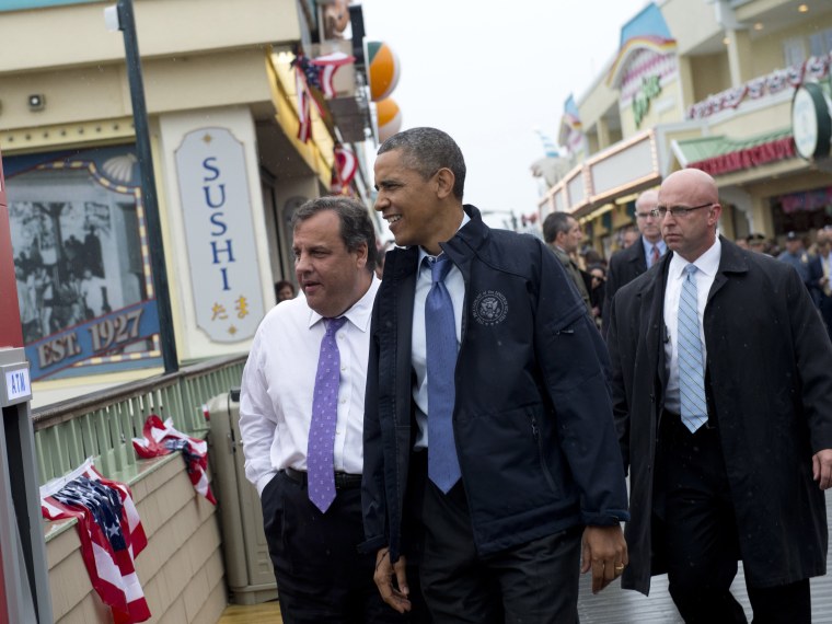 US President Barack Obama and New Jersey Governor Chris Christie (L) walk along the boardwalk as they view rebuilding efforts following last year's Hurricane Sandy in Point Pleasant, New Jersey, on May 28, 2013. (Photo by Saul Loeb/AFP/Getty Images)