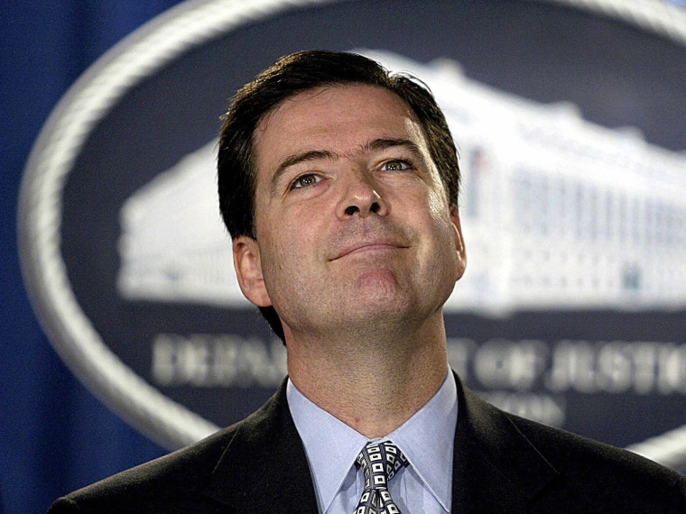 File Photo: US Deputy Attorney General James Comey takes questions on Aug. 5, 2004 at the Justice Department in Washington, DC. The Senate this week confirmed Comey’s nomination as head of the FBI. (Photo by Tin Sloan/AFP/Getty Images, File)