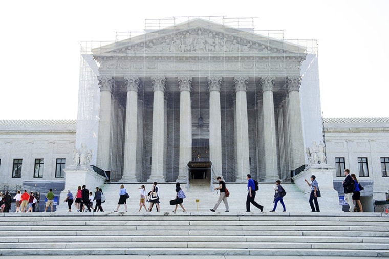 A line of people walk into the Supreme Court in Washington, D.C., on June 20, 2013. Some had been in line for seven hours before the doors were opened. (Photo by Maddie Meyer/The Washington Post/Getty Images)