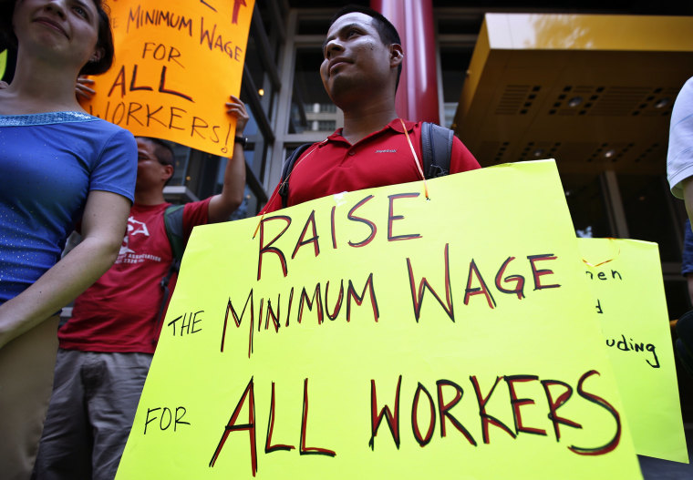 Low wage workers take part in a protest organized by the Coalition for a Real Minimum Wage outside the offices of New York Governor Andrew Cuomo, May 30, 2013. (REUTERS/Mike Segar)