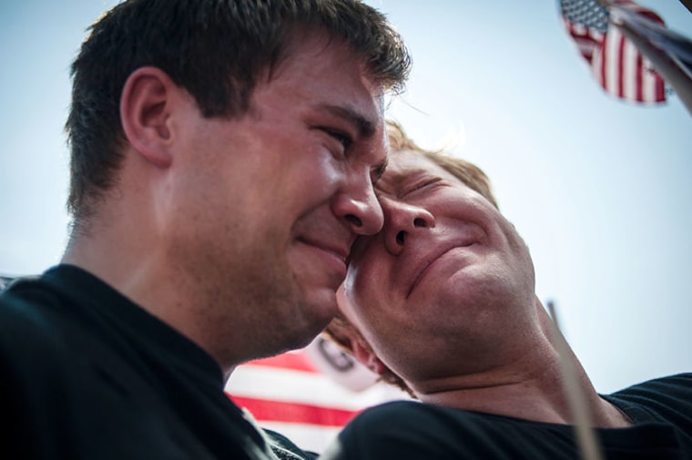 Michael Knaapen (L) and his husband John Becker, both of Wisconsin, react to the 5-4 ruling striking down as unconstitutional the Defense of Marriage Act at the U.S. Supreme Court in Washington June 26, 2013. (Photo by James Lawler Duggan/Reuters)
