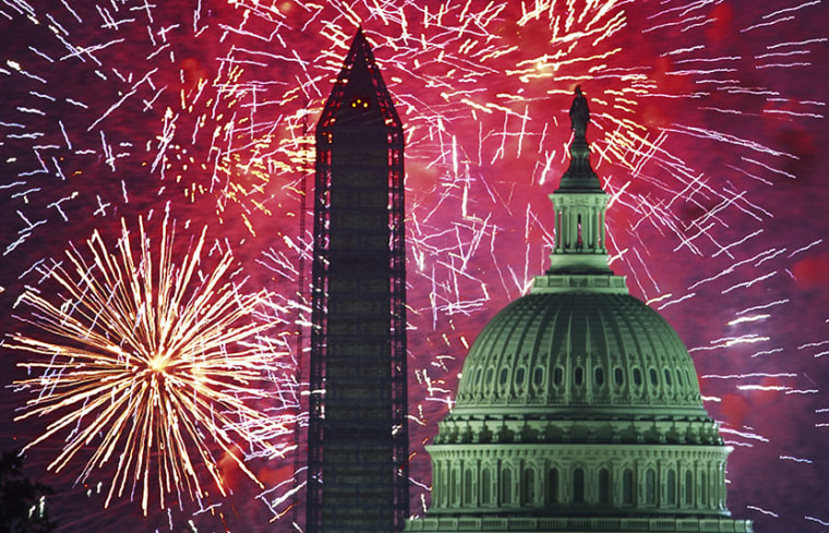 US Independence Day fireworks are seed over the US Capitol and National Monument in Washington, DC on July 4, 2013. (Photo by Paul J. Richards/AFP/Getty Images)