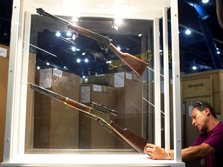 Johnny Bass sets up the Henry Repeating Arms Company booth as exhibitors prepares for National Rifle Association Meetings and Exhibits at the George R. Brown Convention Center on Wednesday, May 1, 2013, in Houston.  (Photo by Johnny Hanson/Houston...