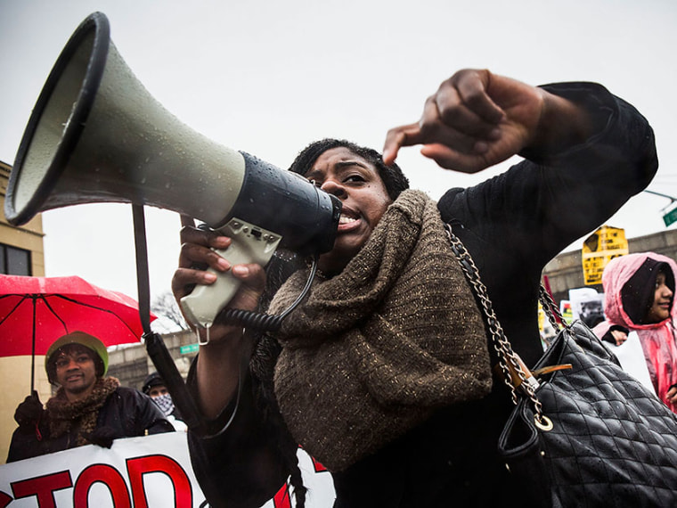 A woman marches against police stop-and-frisk tactics on February 23, 2013 in New York City.   (Photo by Andrew Burton/Getty Images)