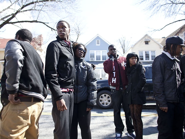Friends and family of Kimani Gray, 16, watch as his casket is carried out after a funeral service on March 23, 2013 in the Brooklyn borough of New York City. Kimani Gray was shot and killed by New York police officers for allegedly pointing a gun at...