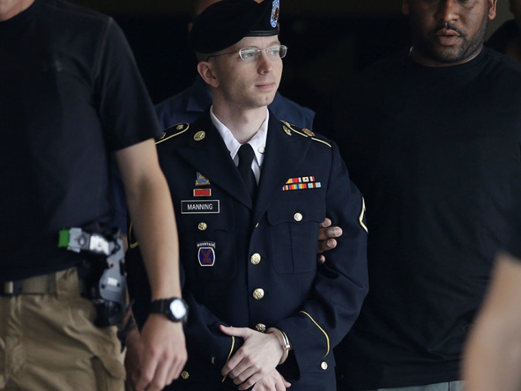 Army Pfc. Bradley Manning is escorted out of a courthouse in Fort Meade, Md., Tuesday, July 30, 2013, after receiving a verdict in his court martial. (Photo by Patrick Semansky/AP)