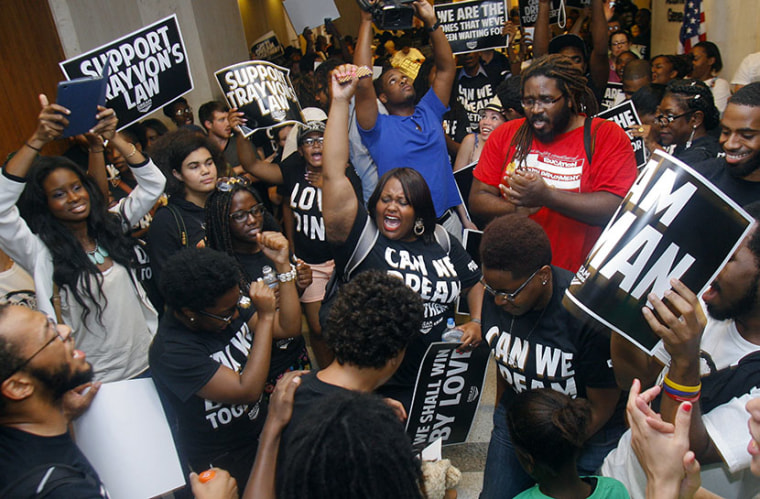Dream Defenders and their supporters protest Friday, July 26, 2013 outside Florida Gov. Rick Scott's office in the Capitol in Tallahassee, Fla. (Photo by Phil Sears/AP)