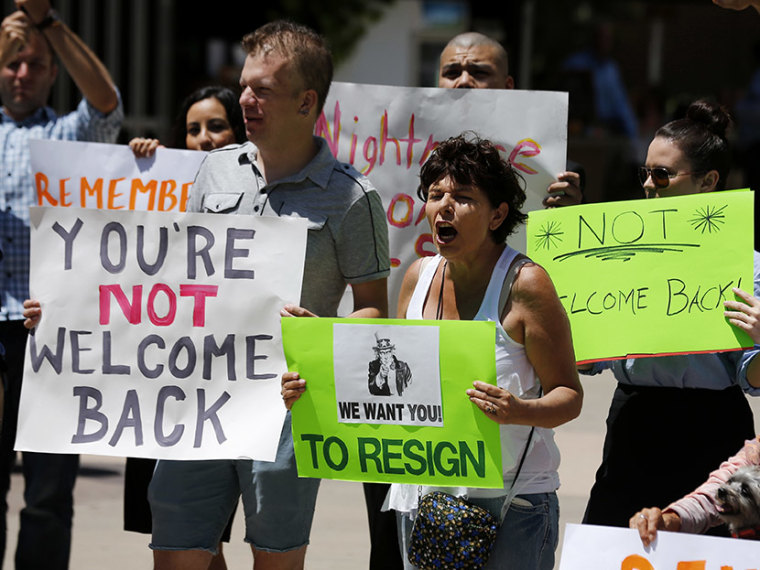 Opponents of San Diego Mayor Filner attend a \"Not Welcome Back'' rally in San Diego