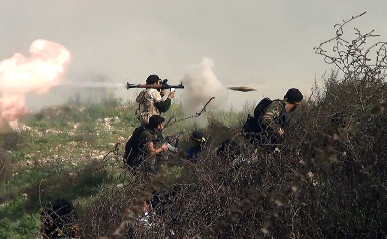 An opposition fighter firing an RPG on August 26, 2013 during clashes with regime forces over the strategic area of Khanasser, situated on the only road linking Aleppo to central Syria.
