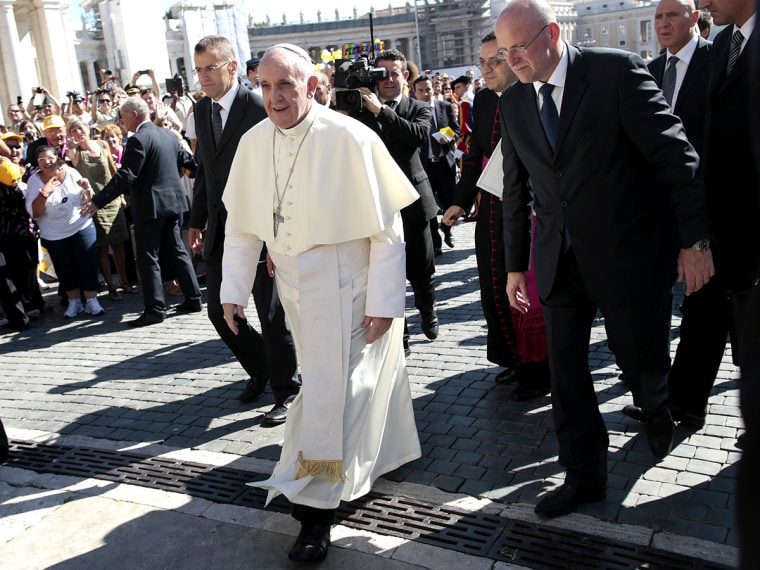 Pope Francis arrives to lead his Wednesday general audience in Saint Peter's Square at the Vatican