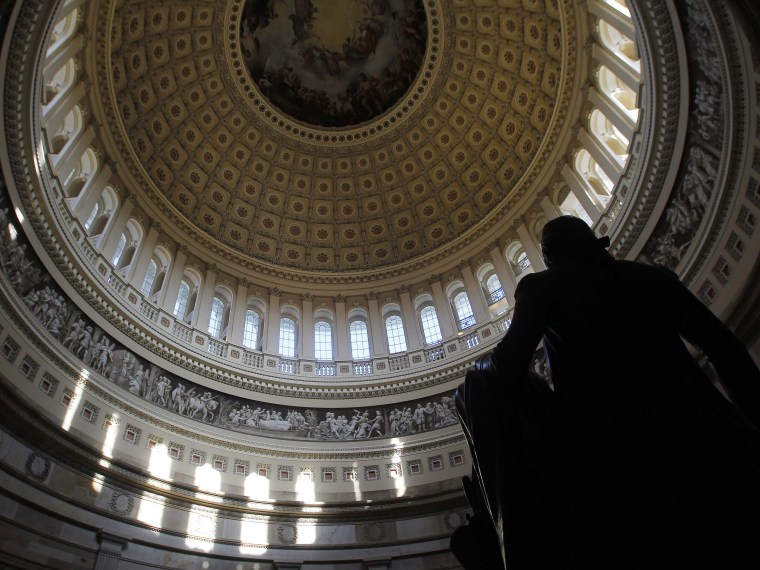 Image: A statue of the United States first President, George Washington, is seen under the Capitol dome in Washington