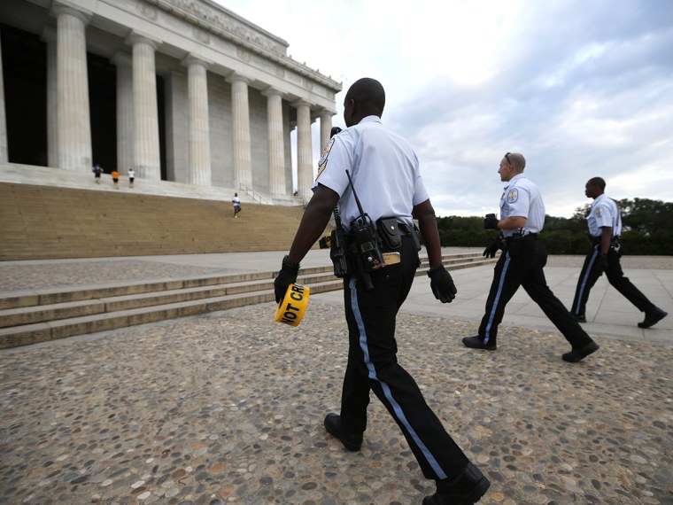 Nationals Parks police arrive with tape to seal off the Lincoln Memorial in Washington